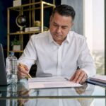 Small business owner reviewing financial papers