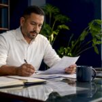 Contractor reviewing business financial documents