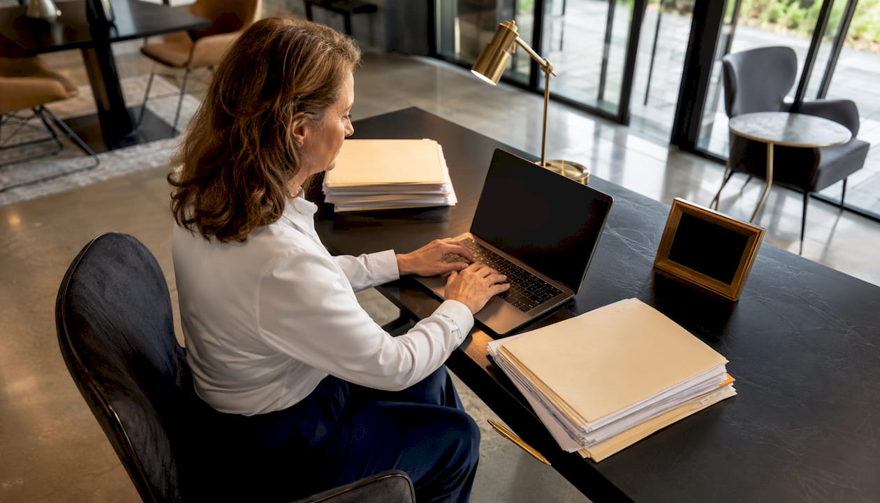 Bookkeeper entering data at standing desk