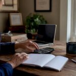 Payroll ledger and calculator on office desk