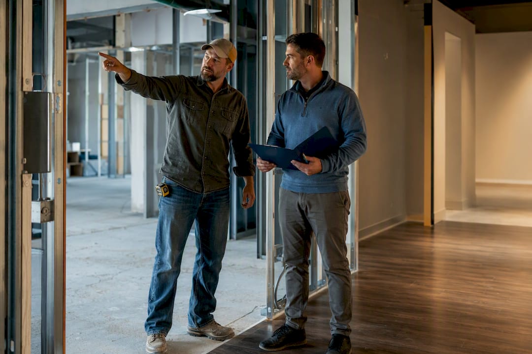 Contractor checking project completion milestones