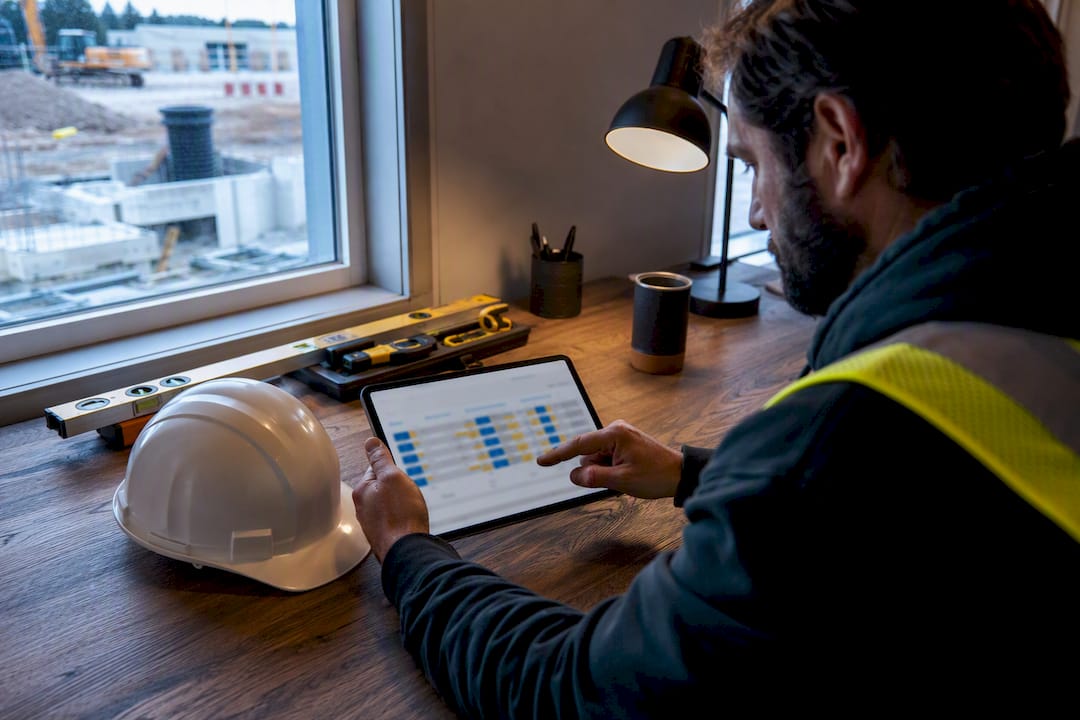 Contractor reviewing weekly cash forecast